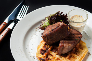 Pork steak with vegetables and garnish
