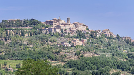 Fototapeta na wymiar Stunning view of the Tuscan hilltop village of Montepulciano, Siena, Italy, on a sunny day