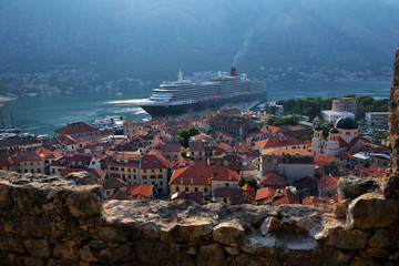 Aerial View of Kotor Old Town with the Historic Orange Tiled Roof Buildings and Bay of Kotor, Montenegro