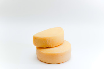 Round appetizing cheese on white