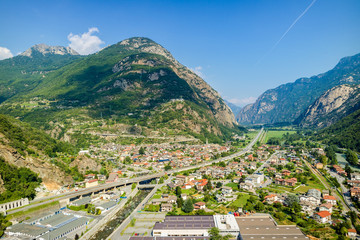 Forte di Bard, Valle d'Aosta, Italy - Agoust 18, 2017: Aerial view of the Italian highway, Alps, Dora Baltea river, Hone, Arnad countries