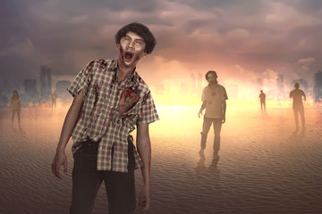 Crowd of aggressive asian zombies with blood walking