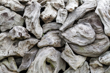 a pile of natural wooden logs background