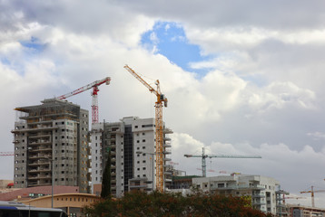 Fototapeta na wymiar Construction of a new residential quarter and office buildings 