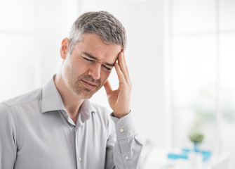 Stressed man with headache