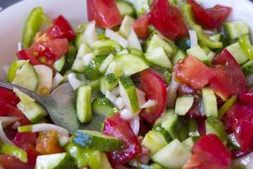 Salad. Lettuce, cucumbers, tomatoes, onions, quail eggs. restaurant