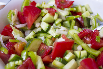 Salad. Lettuce, cucumbers, tomatoes, onions, quail eggs. restaurant