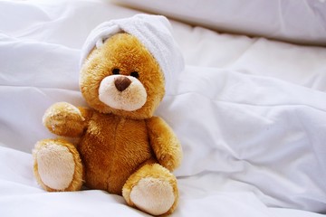 Lonely bear in bed