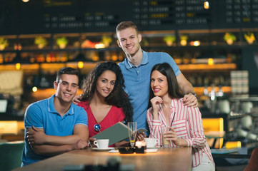 Photo of friends having coffee in cafe