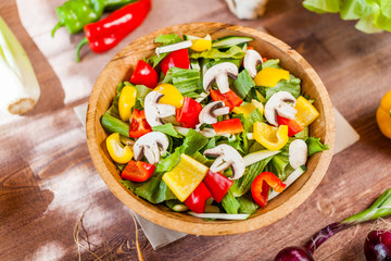 vegetable salad bowl on kitchen table, balanced diet