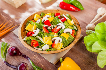 vegetable salad bowl on kitchen table, balanced diet