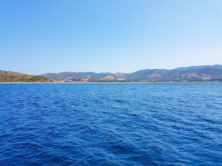  deep blue sea and island with small bushes