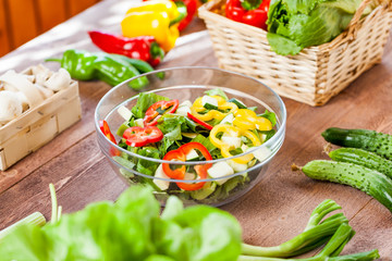 vegetable salad bowl on kitchen table, balanced diet