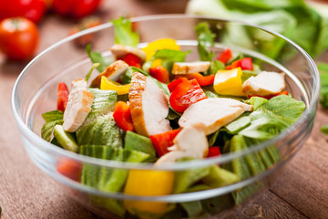 chicken salad bowl on kitchen table, balanced diet