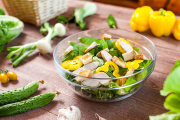 chicken salad bowl on kitchen table, balanced diet