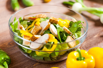 chicken salad bowl on kitchen table, balanced diet