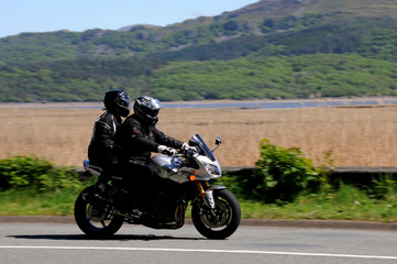 A motorcycle on the open road in Snowdonia, North Wales.
