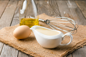 Fresh homemade Mayonnaise on an old wooden table