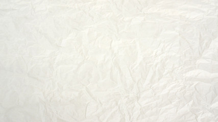White creased paper background texture.