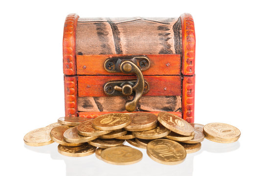 Old wooden chest with golden coins on white background