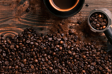 Coffee cup and beans frame on wooden table