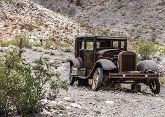 Old vintage car truck abandoned in the desert