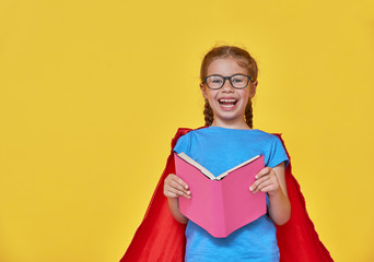 child plays superhero