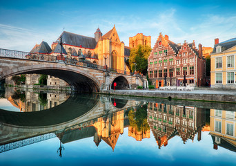Medieval cathedral and bridge over a canal in Ghent - Gent, Belgium - obrazy, fototapety, plakaty