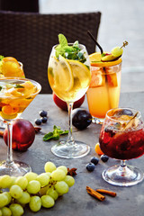 Beautiful Fruit cocktails on dark background with berries;