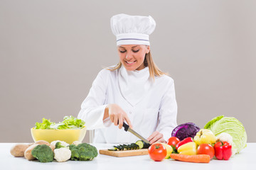 Female chef making healthy meal.