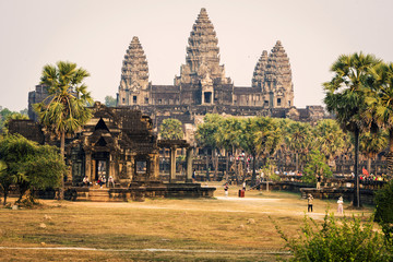 Towers of Angkor Wat temple with rays of sunset evening in Cambodia