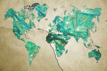 World map in dirty and burned plastic surface on cracked wall. Pollution concept. Elements of this image furnished by NASA.