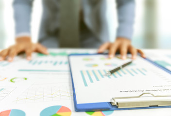 businessman write business plan with chart