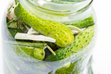 Brined pickles in a jar, with garlic, dill and horseradish