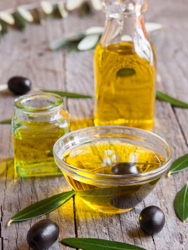Olive oil in a glass bottle and bowls