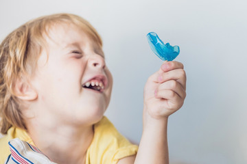 Three-year old boy shows myofunctional trainer to illuminate mouth breathing habit. Helps equalize...