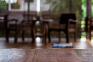 Table of retro wood with rustic wooden interior farmhouse background. Concept trade show for publish advertisement goods