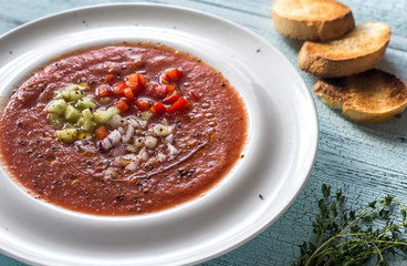 Portion of gazpacho on the wooden table