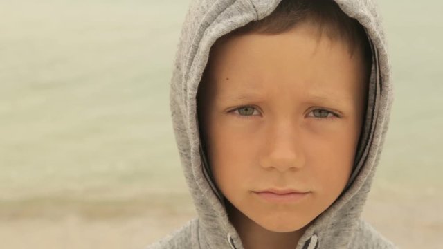 Portrait of a boy against the sea