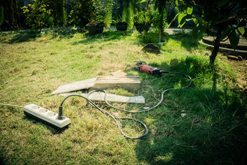 a grind to cut ceramic machine with grass and tree plant