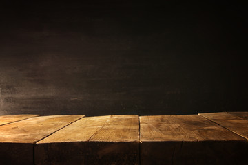 wooden table and blackboard background. Ready for product display montage
