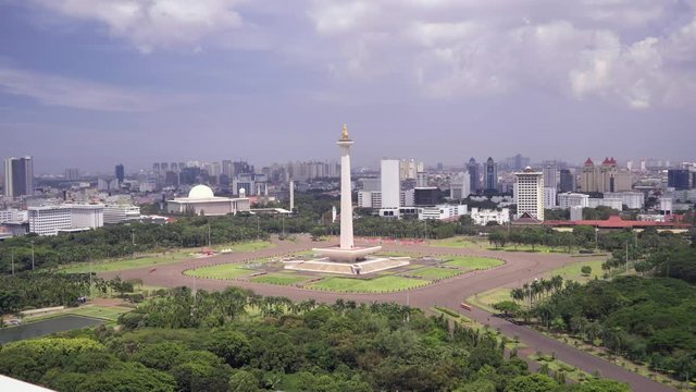 National Monument in the centre of Merdeka Square, Central Jakarta, symbolizing the fight for Indonesia. Filmed from above, fast motion. Shot with Sony a7s and Atomos Ninja Flame.