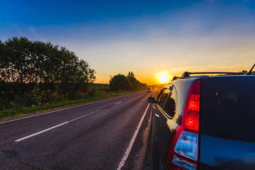 Car on the side of the road sunset