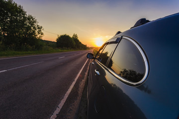 Car on the side of the road sunset