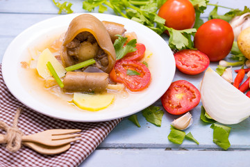 Oxtail soup in white dish on blue  table, Delicious halal food