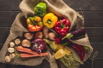 Afwasbaar fotobehang fresh picked vegetables on sacking © LIGHTFIELD STUDIOS