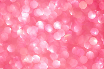 The abstract pink bokeh background
