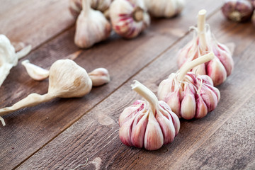 Garlic. Garlic Cloves and Garlic Bulb on a wooden vintage rustic table.