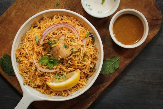 Hyderabadi Chicken Biryani served with Yogurt raita and Salan