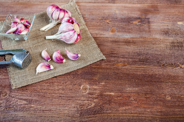 Garlic. Garlic Cloves and Garlic Bulb on a wooden vintage rustic table.